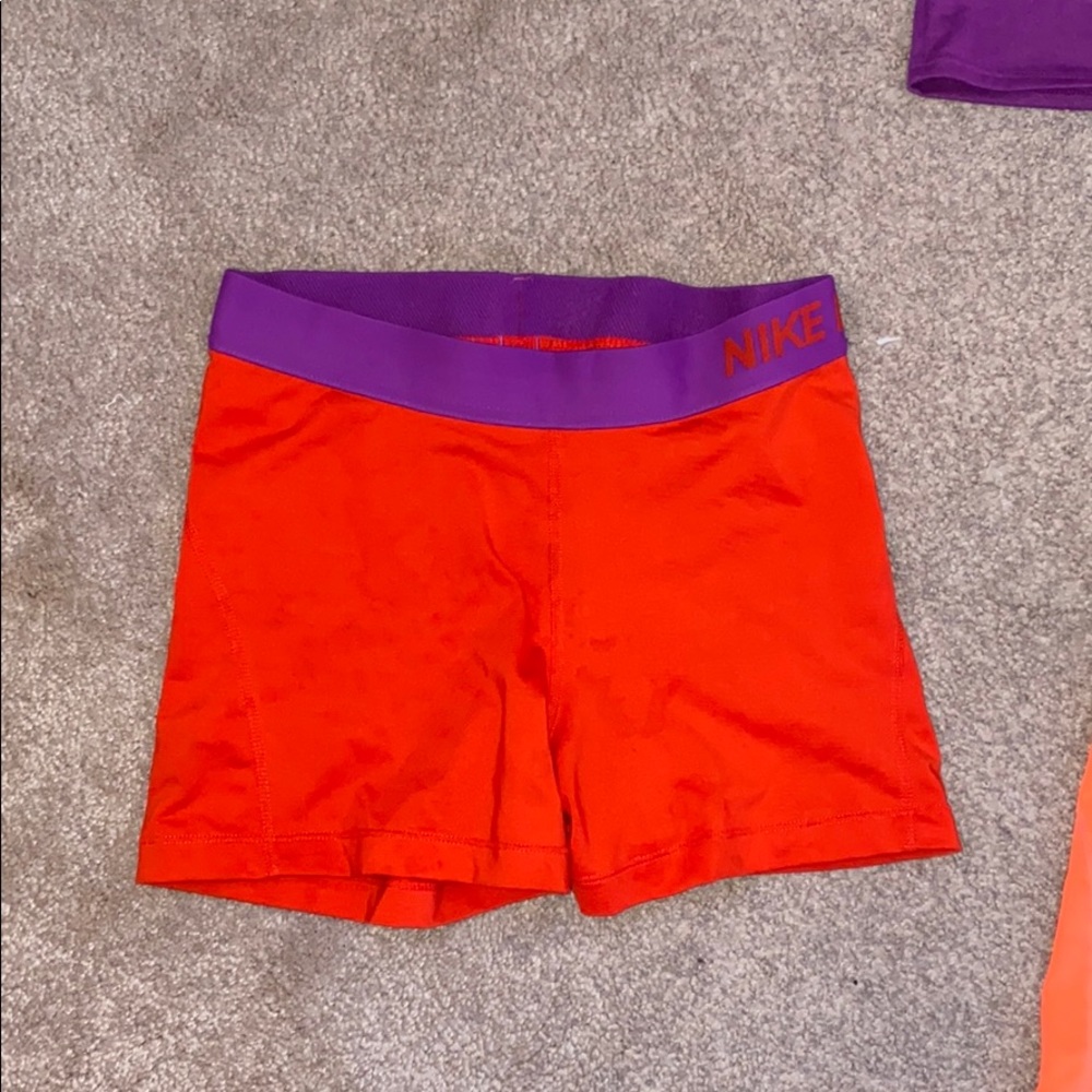 Purple and red Nike spandex